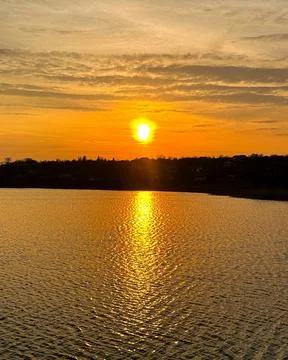 Sunset over the lake 库存照片