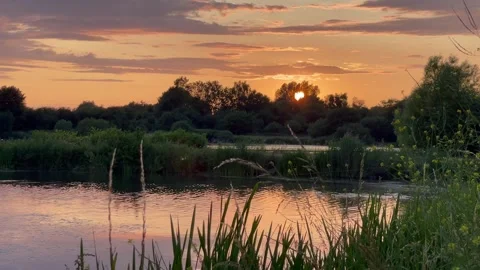Sunset over lake reflections Stock Footage 250405783