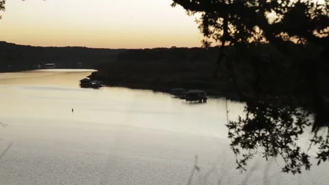 Sunset Over Lake Travis at Dusk with Docks and Boats - Austin, Texas Stock Footage 328536725