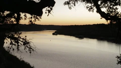 Sunset Over Lake Travis at Dusk with Docks and Boats - Austin, Texas Stock Footage 328536754
