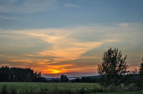 Sunset over landscape Stock Photos