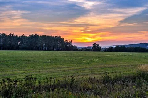 Sunset over landscape Stock Photos