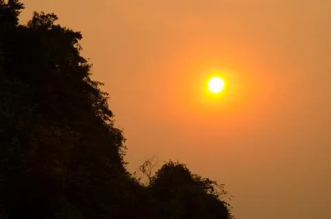 Sunset over a limestone cliff. Stock Photos