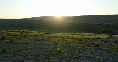 Sunset over limestone pavement in Yorkshire Dales Stock Footage 313984407