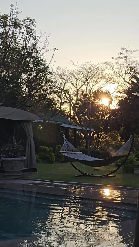 Sunset over the Lodge Pool, Boutique Hotel, Hazyview, South Africa – Vertical 8K Stock Footage 347922646