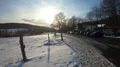 Sunset over low mountain range valley tourism location in winter with snow 4k or 4k+ Resolution