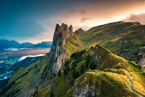 Sunset over majestic rocky mountain ridge of Saxer Lucke, Swiss Alps in aut.. Stock Photos