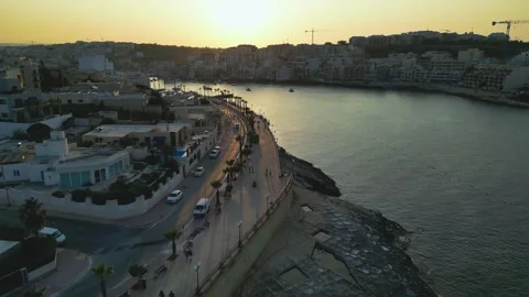 Sunset over Marsaskala Bay, pull back aerial view Stock Footage 321531641