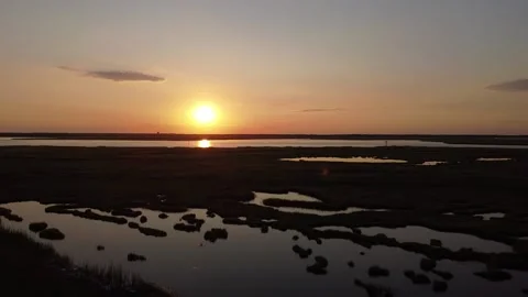 Sunset over marsh aerial view 動画素材 138130188