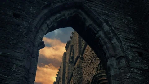 Sunset Over Medieval Abbey Seen Through Arch Stock Footage 345098615