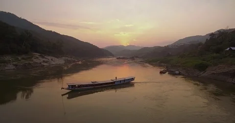 Sunset Over The Mekong River And Traditional Cruise Boats, Pak Beng, Laos, Stock Footage 80100674