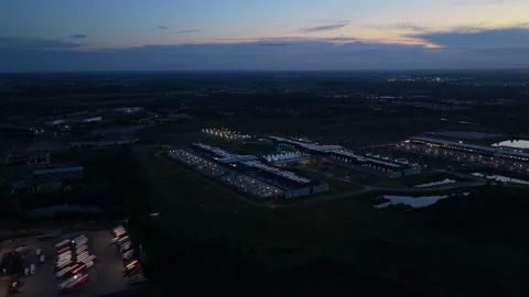 Sunset over Meta’s glowing data campus, aerial night scene. Stock-Footage 318620381