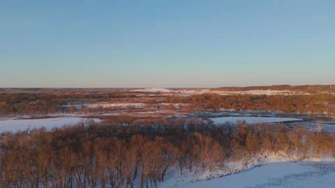 Sunset over Minnesota valley during winter, covered in snow during golden hour 8 Видео 331751262