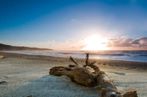 Sunset over a misty beach Stock Photos