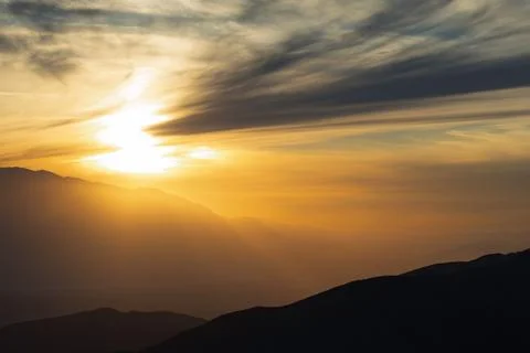 Sunset Over Misty Mountain Ridges Stock Photos