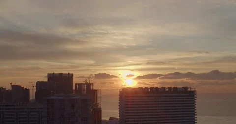 Sunset over modern city view from balcony or observation deck. Development of Stock Footage 169983099