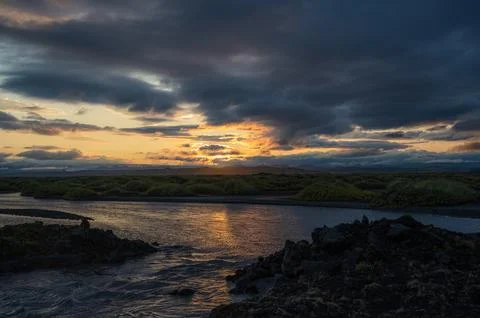 Sunset over moss fields in Iceland. Scenery, travel banner Stock Photos