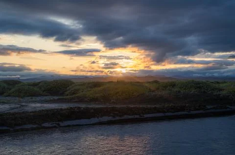 Sunset over moss fields in Iceland. Scenery, travel banner Stock Photos