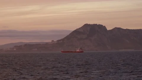 Sunset over the mount while the sun reflected on the waves Stock Footage 143614695