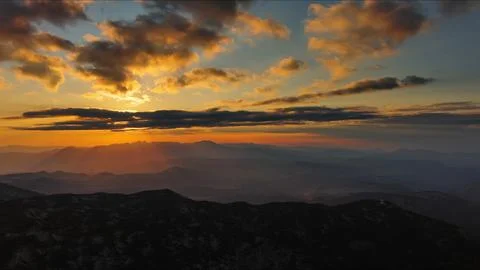 Sunset over mountain with dramatic clouds Stock Photos