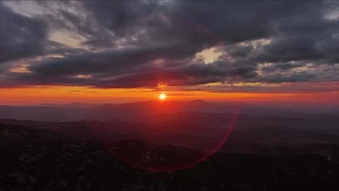 Sunset over mountain with dramatic clouds Stock Photos