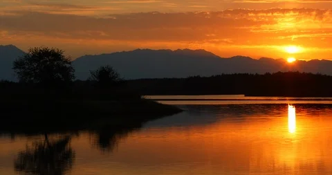 Sunset over the mountain lake Video stock 112312279