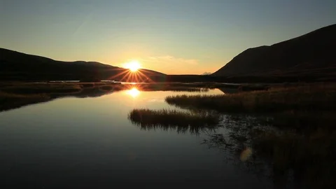 Sunset over mountain lake in summer Stock Footage 72297994