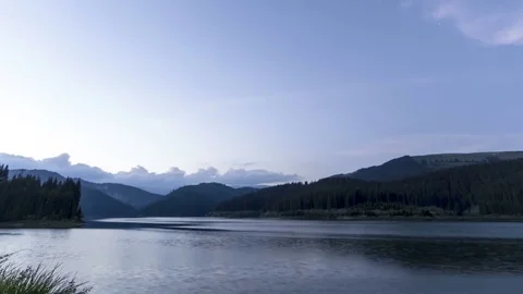 Sunset over mountain lake in summer Video stock 76585811