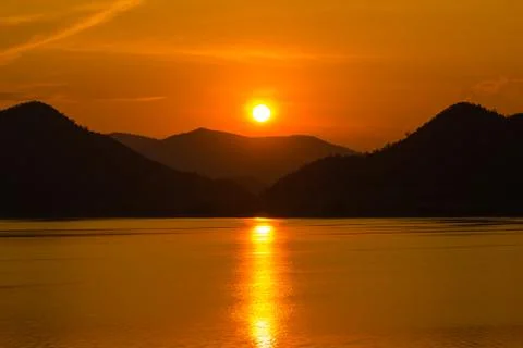 Sunset over the mountain Stock Photos