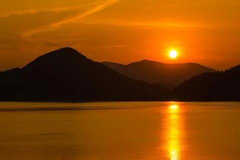 Sunset over the mountain Stock Photos