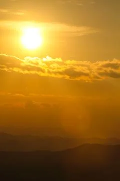 Sunset over mountain Stock Photos