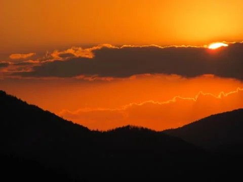 Sunset over the mountain Stock Photos
