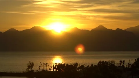 Sunset over mountain range and sea Stock Footage 230512503