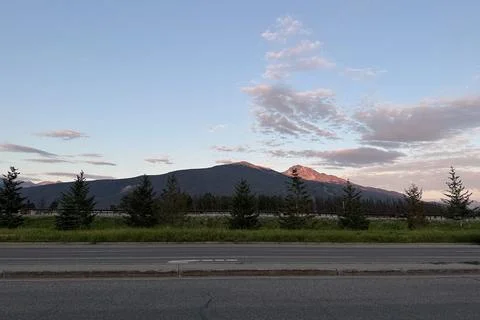 Sunset over a mountain range in Jasper. Canada. Stock Photos
