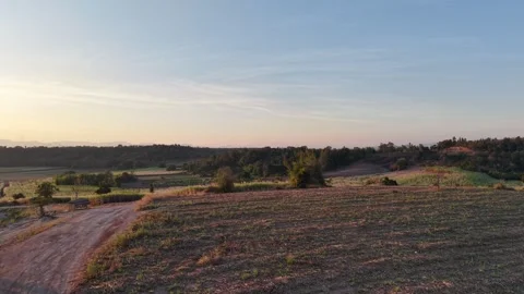 Sunset Over Mountain Range in Peaceful Countryside Stock Footage 325686684