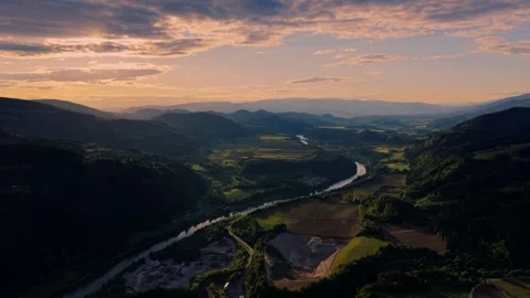 Sunset over mountain river valley Stockbeeldmateriaal 335210464