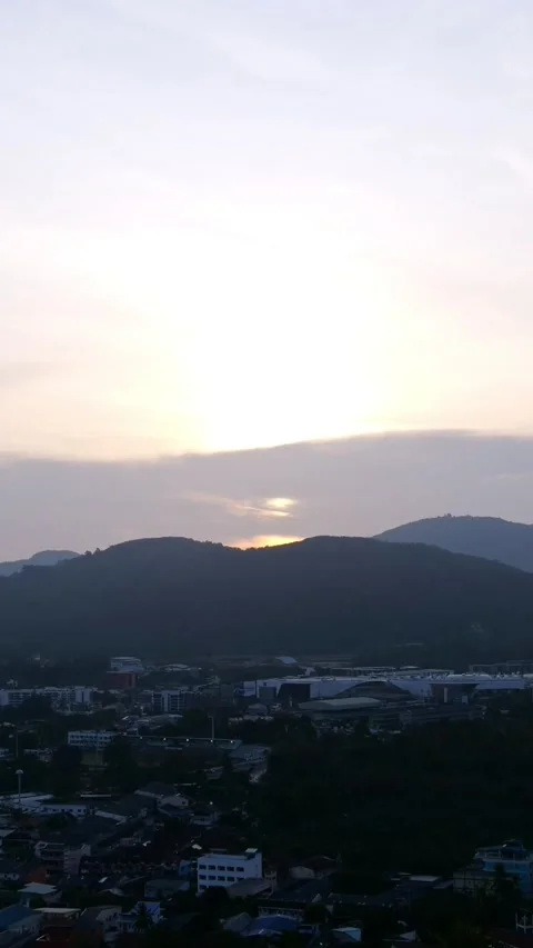 Sunset Over Mountain Town Skyline Travel. Soft Pastel Sky With Amber Glow As Sun Stock-Footage 333775276