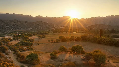 Sunset Over Mountain Valley And Farmland Stock Footage 330541937