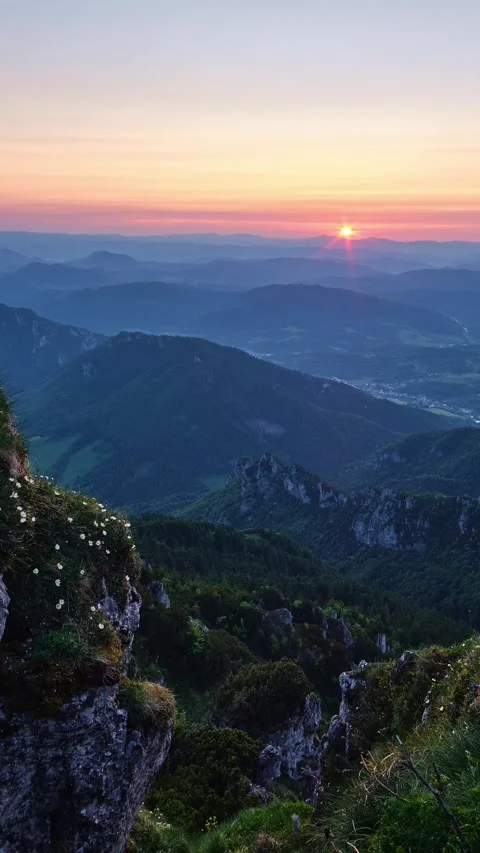 Sunset Over Mountainous Landscape with Distant Village Video stock 313593752