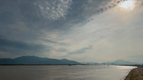 Sunset over Mountains and Reflective Waters 4K Timelapse Stock Footage 320809140