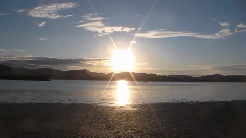 Sunset over the mountains in the background of the river in Laredo,Spain. Stock Footage 92280912