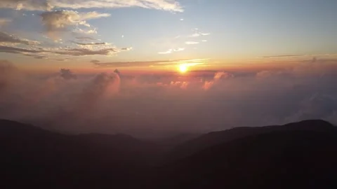 Sunset over the mountains with clouds flying Stock Footage 290793533