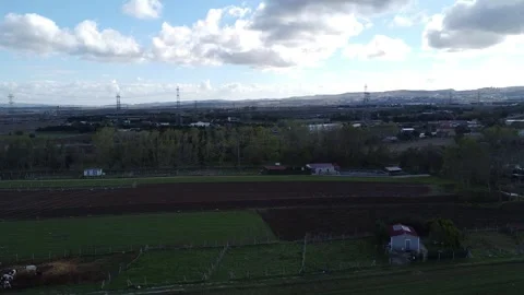 Sunset Over Mountains with Dramatic Clouds and Long Road – 4K Drone Footage Stock Footage 320193882