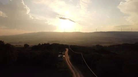 Sunset Over Mountains with Long Road – Cinematic 4K Drone Footage Stock Footage 320198475