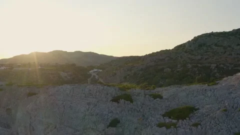 Sunset Over Mountains Ocean Bay Morning Sunrise Drone Aerial Soft Tilt Up Stock Footage 154521617