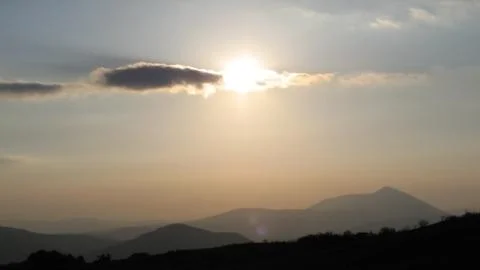 Sunset over mountains Stock Photos