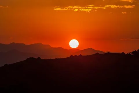 Sunset over mountains 스톡 사진