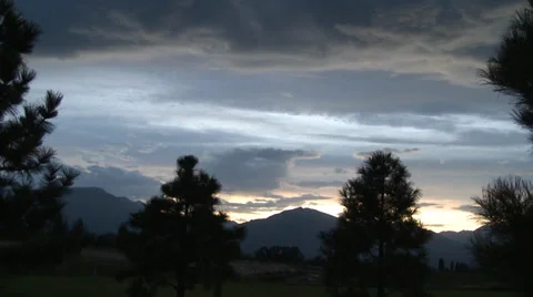 Sunset over Mountains with Pine Trees Stock Footage 39578655