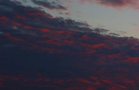Sunset over the mountains red cloudy on the sky Foto stock