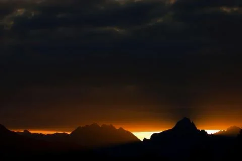 Sunset over the mountains reflections in the upper Brembana valley Stock Photos